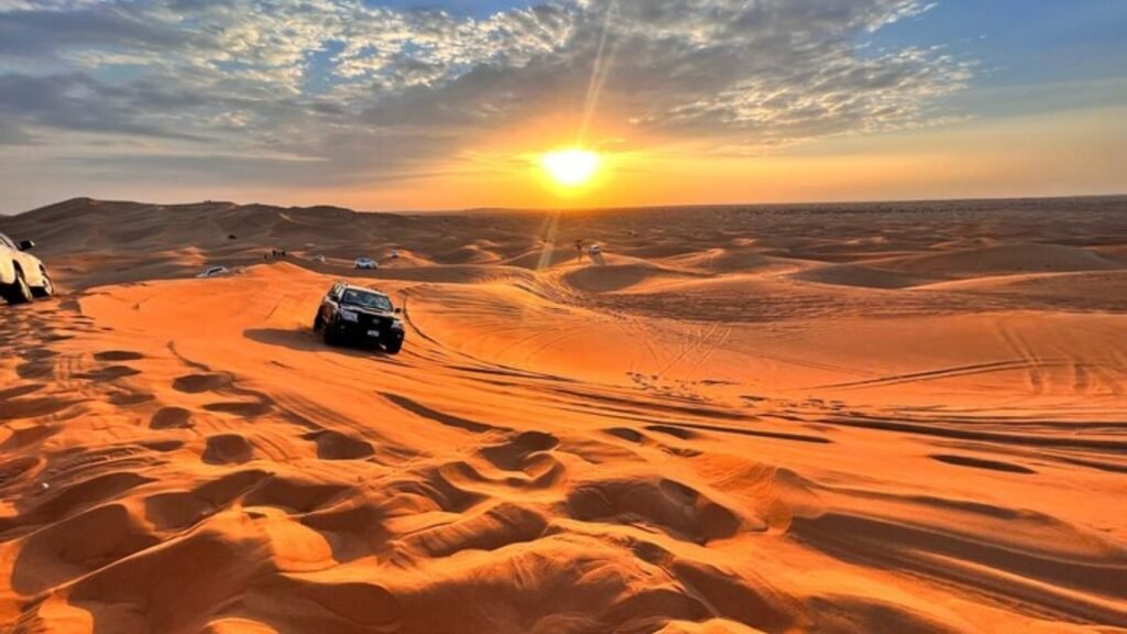 Dubai Desert Safari featuring golden sand dunes, camel rides, dune bashing, and a stunning Arabian desert sunset